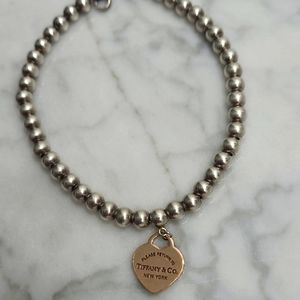 Tiffany bracelets with small heart.